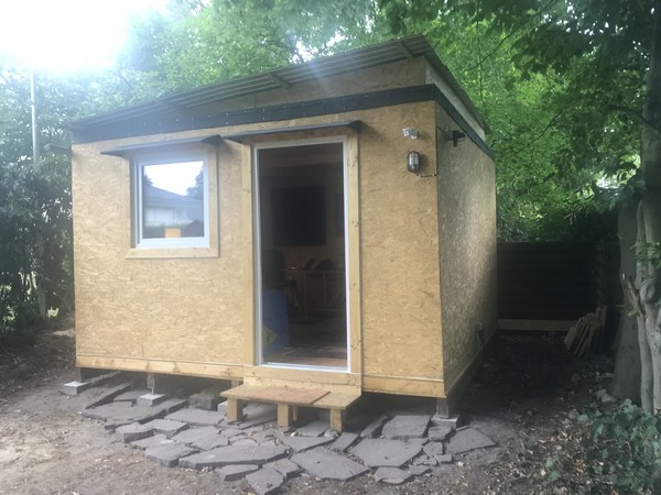 The right side, containing the power inlet and some spare OSB in the back.