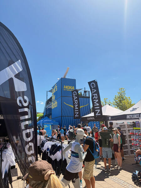 Three-story HOKA booth with a rooftop terrace
