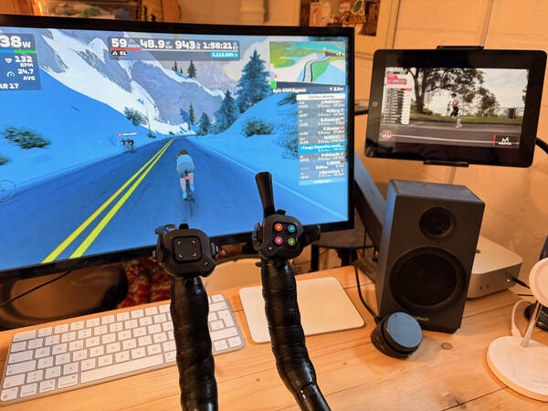 Riding Zwift, watching triathlon livestreams (this is the IRONMAN Pro Series race at IRONMAN 70.3 Geelong, Australia)