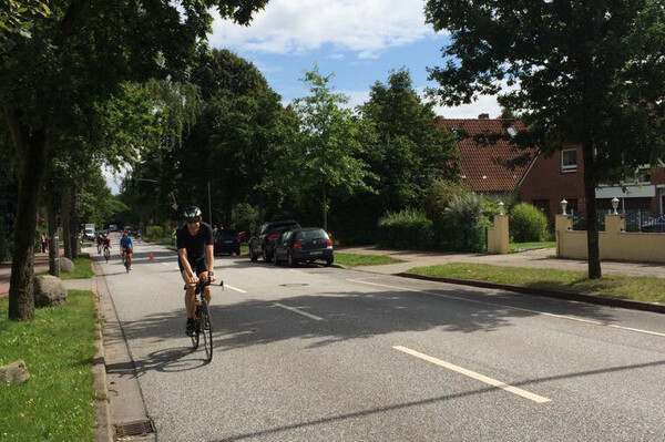 Watching me going uphill during those rare sunny moments of the bike part