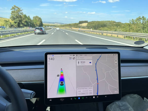 Driving home with the Tesla autopilot, which now shows a rainbow road, matching my feelings of content perfectly