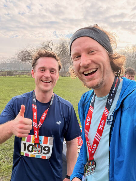 Third place finisher at the Victoria Park half marathon next to me, who came in fourth &mdash; notice, no snow!