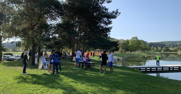 Volunteers helping to set everything up next to the completely flat lake