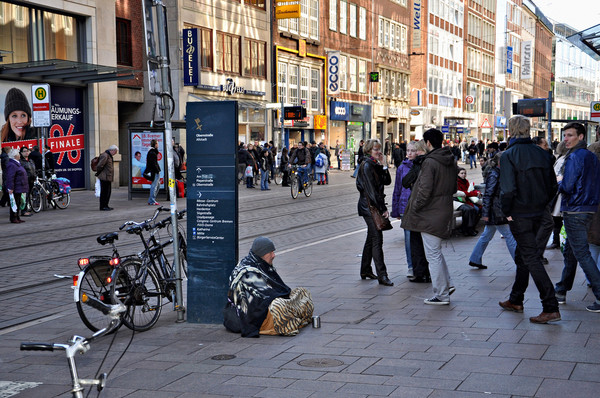 See how we have accepted homeless people just blending into the city picture