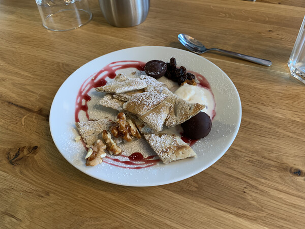 Pancakes Austrian style with cherries, chocolate and yoghurt ice-cream