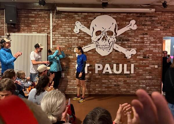 Our top one female in the 100 miler, she was the only female starter and finisher, being celebrated inside the crowded Clubheim