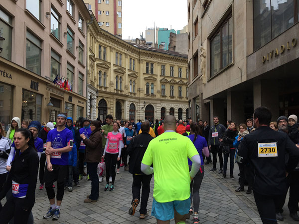 Relay race switching station including lots of pedestrians